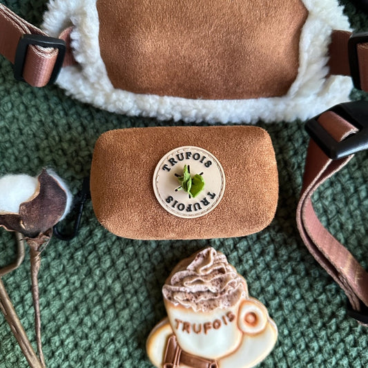 Mocha poop bag holder with a zip closure and a snap hook for attaching to a leash, backpack, or jeans.