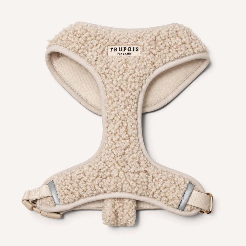 A cream-colored fleece dog harness by Trufois Finland, shown from a top-down view on a light off-white background.